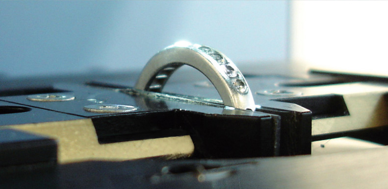 Diamond ring under LUMOS II FTIR microscope to identify synthetic diamonds. 